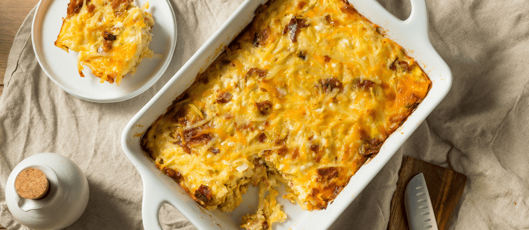 Egg and cheese casserole in a white baking dish